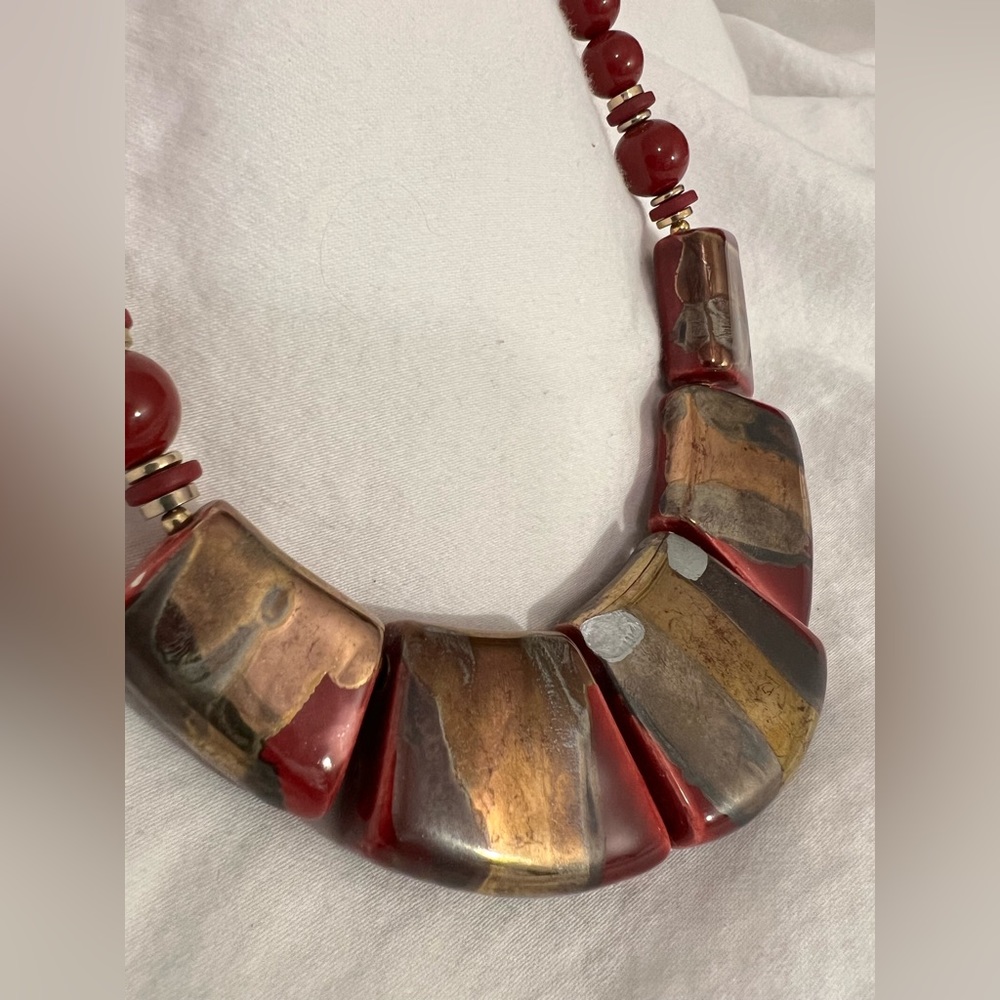 Red, painted vintage necklace.